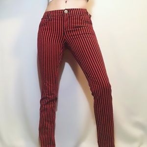 DIVIDED red + black striped skinny jeans